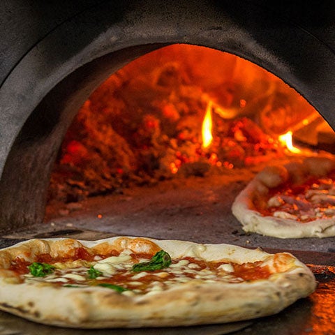 Wood fire pizza ready to be put in the oven.