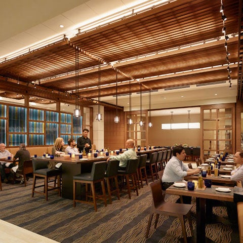 Interior dining room with guests eating.
